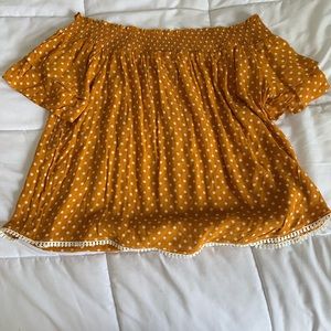 Orange cold shoulder polka-dot top